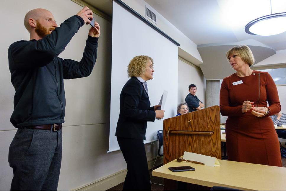Trent Nelson  |  The Salt Lake Tribune
Salt Lake City Mayor Jackie Biskupski and Councilwoman Lisa Adams speak before Salt Lake City officials appeared before the Sugar House Community Council at the Sprague Library in Salt Lake City, addressing the shelter at 653 E. Simpson, Wednesday January 4, 2017. At left is Councilman Derek Kitchen, photographing an overflow crowd.