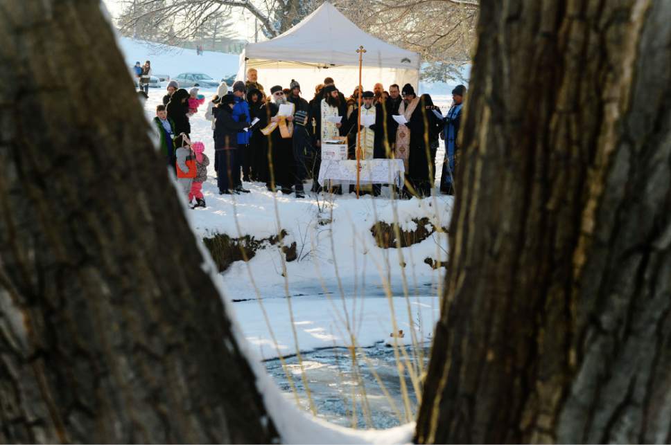 Steve Griffin / The Salt Lake Tribune

Greek Orthodox gather at Sugar House Park in Salt Lake City for the Theophany Blessing of the Water Jan. 6, 20017. Orthodox Christians celebrate the Feast of Theophany (known as Epiphany by Western Christians)  is the 12th day of Christmas and commemorates Jesus Christ's revelation as God. While some Christians emphasize the three wise men reaching the Christ child, Orthodox Christians remember his baptism in the Jordan River and God's revelation that Jesus was his son.