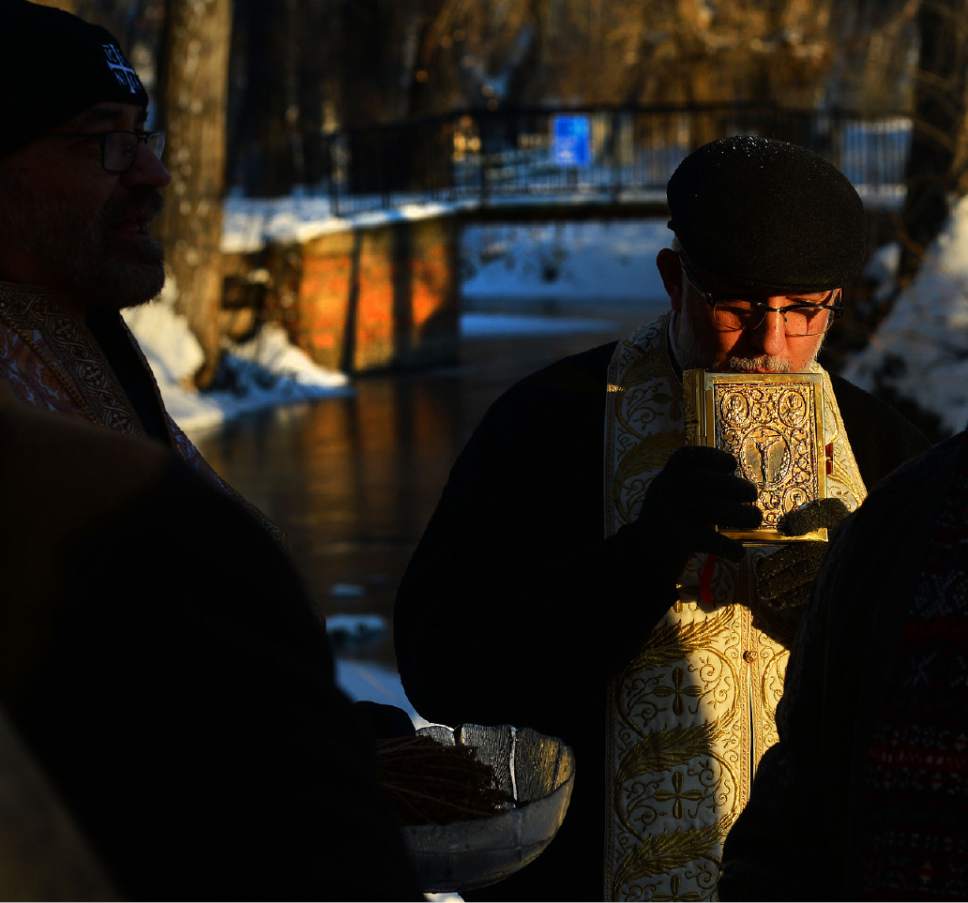 Steve Griffin / The Salt Lake Tribune

Father Elias Koucos and Father Anthony Savas give blessings as Greek Orthodox gather at Sugar House Park in Salt Lake City for the Theophany Blessing of the Water Jan. 6, 20017. Orthodox Christians celebrate the Feast of Theophany (known as Epiphany by Western Christians)  is the 12th day of Christmas and commemorates Jesus Christ's revelation as God. While some Christians emphasize the three wise men reaching the Christ child, Orthodox Christians remember his baptism in the Jordan River and God's revelation that Jesus was his son.