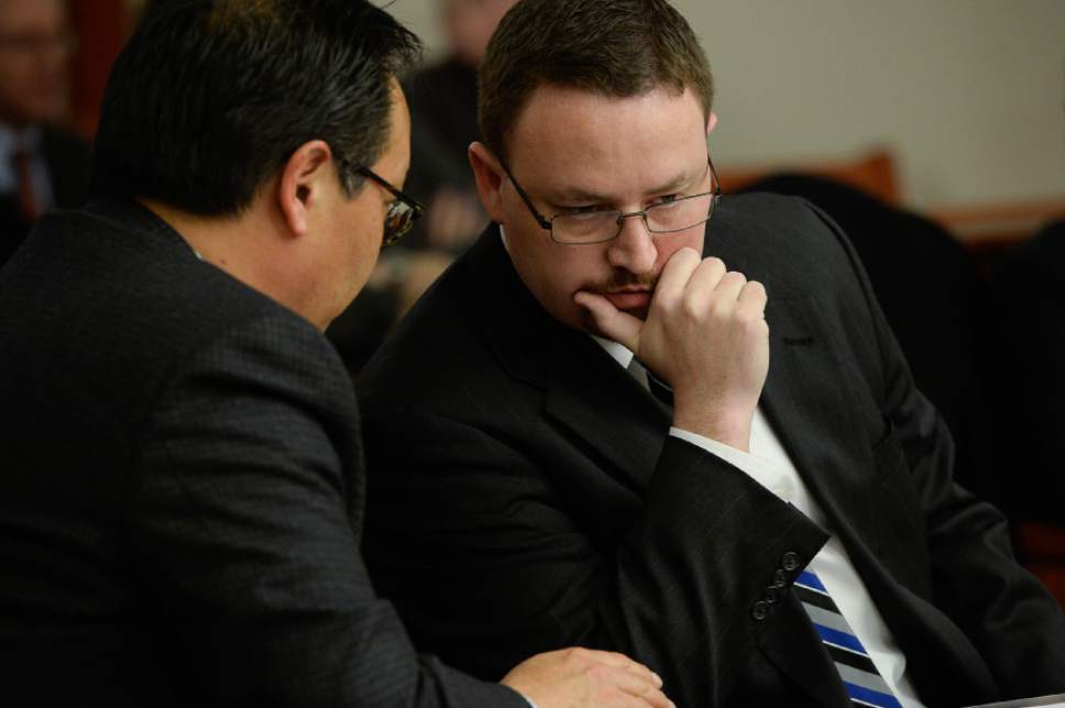 Francisco Kjolseth | The Salt Lake Tribune
Prosecutors Blake Nakamura, left, and Scott Sutton confer with one another as former Chief Deputy for Utah Attorney General Kirk Torgensen appeared at the Matheson Courthouse in Salt Lake City on Tuesday, Jan. 10, 2017, asking for an immediate release after prosecutors had him arrested to ensure he would show up for the February trial of former Utah Attorney General John Swallow. Judge Elizabeth Hruby-Mills ordered Torgensen be released, surrender his passport and appear in Utah on Feb. 8, 9, 10, to serve as a witness for prosecutors in Swallow's case.