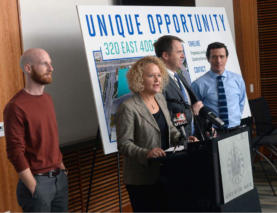 Al Hartmann  |  The Salt Lake Tribune
Salt Lake City Council member, District 4, Derek Kitchen, left, Mayor Jackie Biskupski, Mike Akerlow, Deputy Director of Community and Neighborhoods, and Justin Belliveau, COO of Redevelopment Agency announce plans  to launch a development that includes "start up" micro-unit apartments, business incubator space and affordable housing units, as well as market-rate space and ground-level retail, on a 2.3-acre property at the site of the old Barnes Bank building at 320 East 400 South.