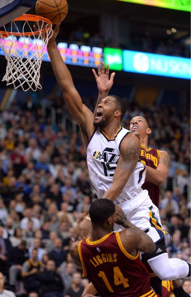 Steve Griffin / The Salt Lake Tribune

Utah Jazz forward Derrick Favors (15) gets to the basket over the top of Cleveland Cavaliers guard DeAndre Liggins (14) during the Utah Jazz versus Cleveland Cavaliers NBA basketball game at Vivint Smart Home Arena in Salt Lake City Tuesday January 10, 2017.