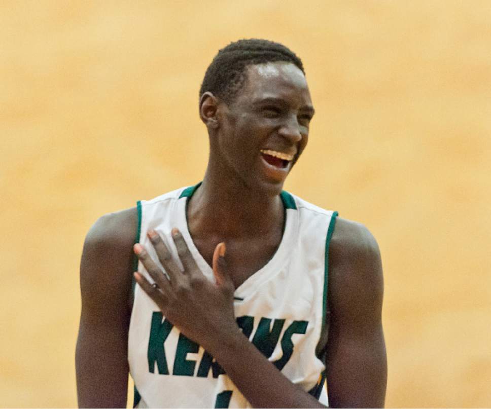 Michael Mangum  |  Special to the Tribune

Kearns Cougars sophomore Majok Kuath (1) reacts joyfully during their prep basketball game against the Hillcrest Huskies at Kearns High School in Salt Lake City on Tuesday, January 10, 2017. Kearns won 70-59.