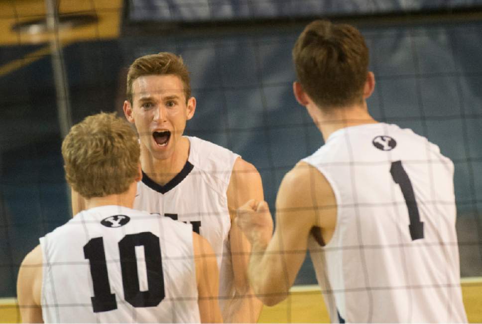 Rick Egan  |  The Salt Lake Tribune

Brigham Young Cougars Leo Durkin (4) celebrates a BYU score with his team mates Brigham Young Cougars Jake Langlois (10) and Brigham Young Cougars Price Jarman (1), in the Mountain Pacific Sports Federation Volleyball Championship game, in tournament action at the Smith Field House in Provo, Saturday, April 23, 2016.