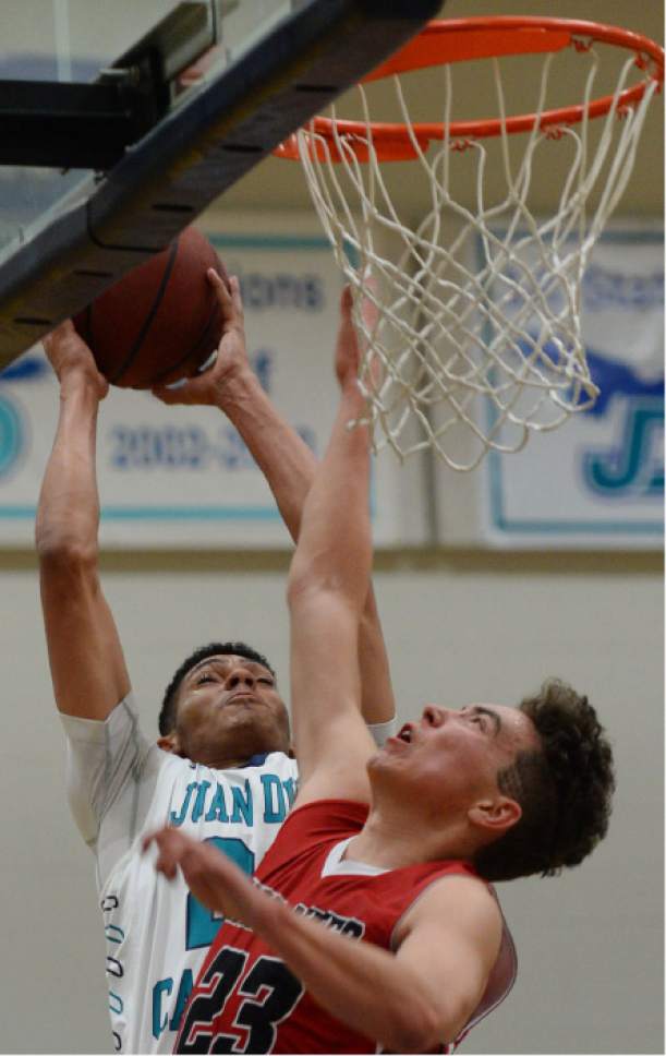 Steve Griffin / The Salt Lake Tribune

 Juan Diego's Steven Price shoots over Bear River's Mike Litchford during game at Juan Diego Catholic High School in Draper Wednesday January 11, 2017.