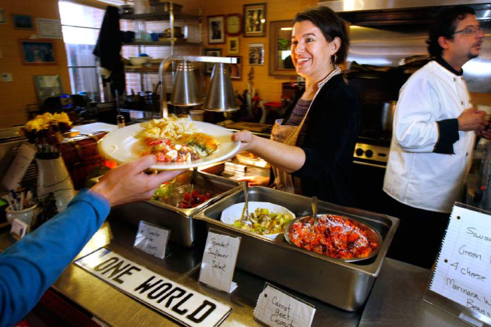 Scott Sommerdorf  |  The Salt Lake Tribune
In this 2008 file photo, Denise Cerreta helps serve a customer's lunch at The One World Cafe.