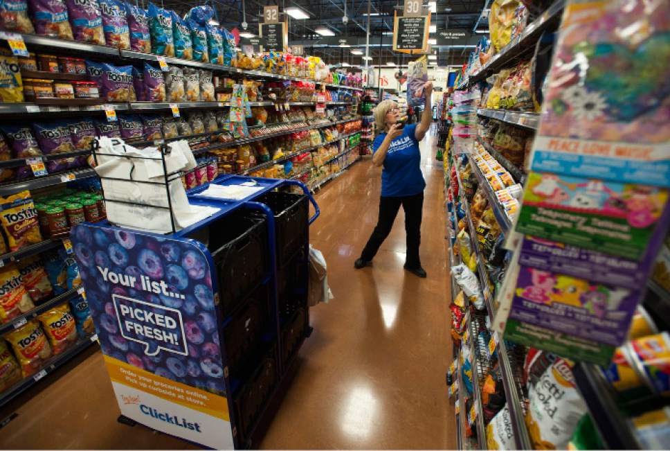 Steve Griffin | The Salt Lake Tribune

Smith's food selector Debbie Burton fills online orders in the Bountiful Smith's on Thursday, Jan. 5, 2017. Smith's started its "Click It" program six months ago and now 20 of its Utah stores offer the program.