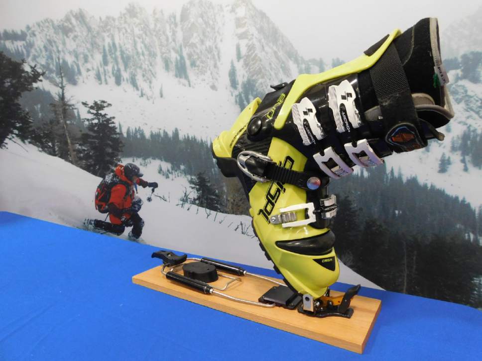 Erin Alberty  |  The Salt Lake Tribune

The Telemark Tech System binding uses two metal pins to hinge the toe of the boot the ski binding. That eliminates the resistance on the heel and allows for more efficient touring.