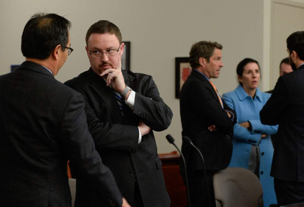 Francisco Kjolseth | The Salt Lake Tribune
Prosecutors Blake Nakamura, left, and Sam Sutton confer with one another during an appearance by Chief Deputy for Utah Attorney General Kirk Torgensen at the Matheson Courthouse in Salt Lake City on Tuesday, Jan. 10, 2017, who was asking for an immediate release after prosecutors had him arrested to ensure he would show up for the February trial of former Utah Attorney General John Swallow. Judge Elizabeth Hruby-Mills ordered Torgensen be released, surrender his passport and appear in Utah on Feb. 8, 9, 10, to serve as a witness for prosecutors in Swallow's case.