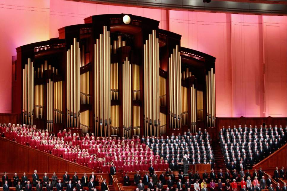 FILE - In this Oct. 1, 2016, file photo, the Mormon Tabernacle Choir of The Church of Jesus Christ of Latter-day Saints, sings in the Conference Center at the morning session of the two-day Mormon church conference in Salt Lake City. Choir member Jan Chamberlin posted a resignation letter that she says she sent to choir leaders on her Facebook page Thursdaym Dec. 29, 2016. In it, she writes that by performing at the inaugural, the 360-member Choir will appear to be "endorsing tyranny and facism" and says she feels "betrayed" by the choir's decision to take part. (AP Photo/George Frey, File)