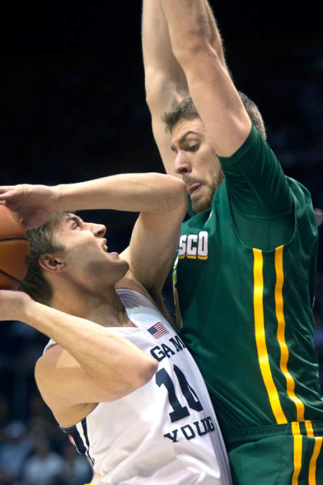 Chris Detrick  |  The Salt Lake Tribune
Brigham Young Cougars guard Steven Beo (10) is blocked by San Francisco Dons center Jimbo Lull (5) during the game at the Marriott Center Thursday January 12, 2017.
