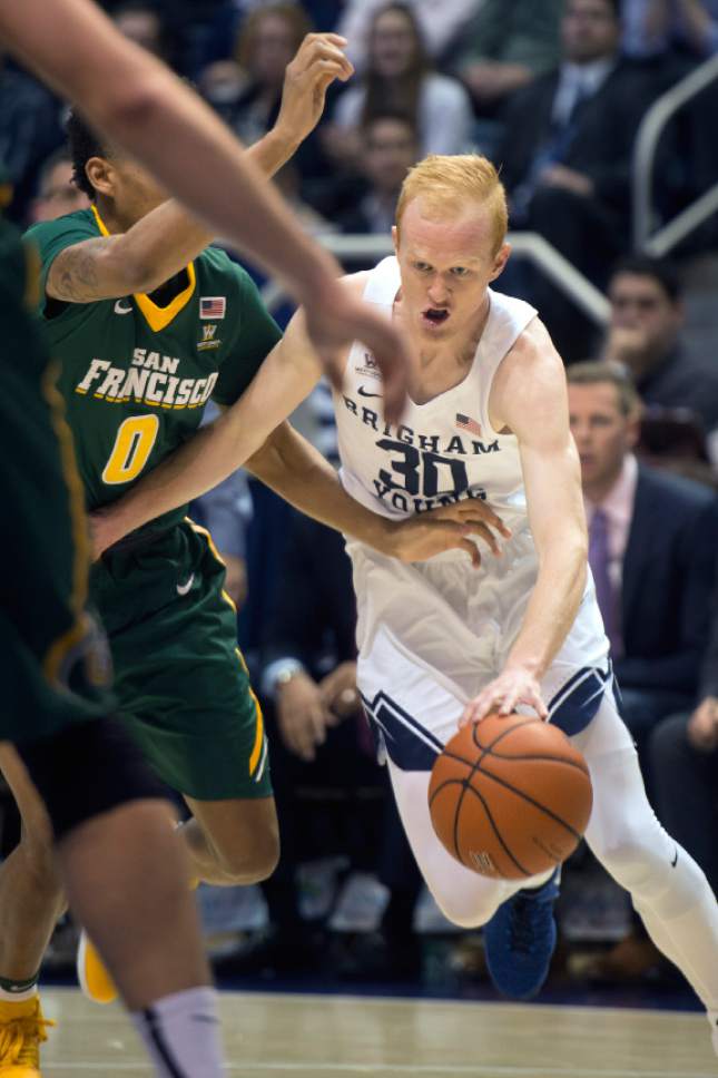 Chris Detrick  |  The Salt Lake Tribune
Brigham Young Cougars guard TJ Haws (30) runs past San Francisco Dons guard Marquill Smith (0) during the game at the Marriott Center Thursday January 12, 2017.