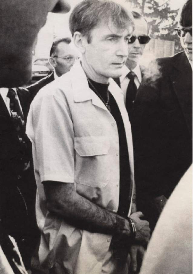 Tribune file photo
Gary Gillmore is shown Dec. 15, 1977, on his way to court to be re-sentenced to death.