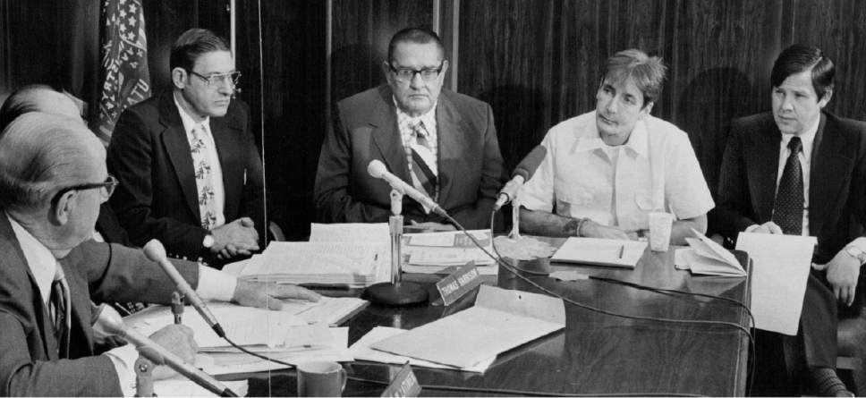 |  Tribune File Photo

Lynn R. Johnson and Gary Gilmore in a meeting, December 31, 1976.