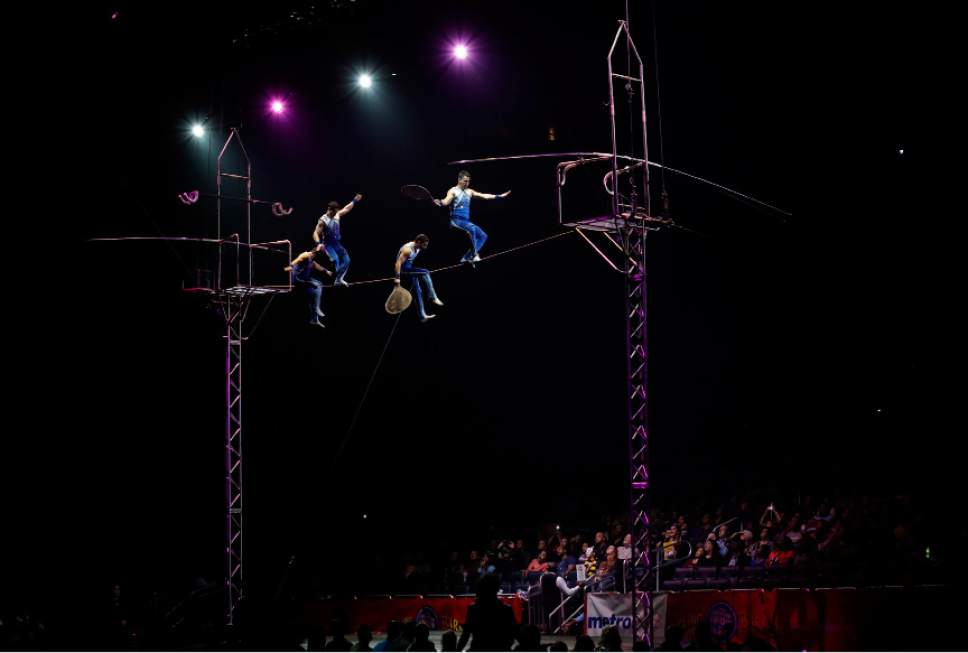 A Ringling Bros. and Barnum & Bailey high wire act performs Saturday, Jan. 14, 2017, in Orlando, Fla. The Ringling Bros. and Barnum & Bailey Circus will end the "The Greatest Show on Earth" in May, following a 146-year run of performances. Kenneth Feld, the chairman and CEO of Feld Entertainment, which owns the circus, told The Associated Press, declining attendance combined with high operating costs are among the reasons for closing. (AP Photo/Chris O'Meara)