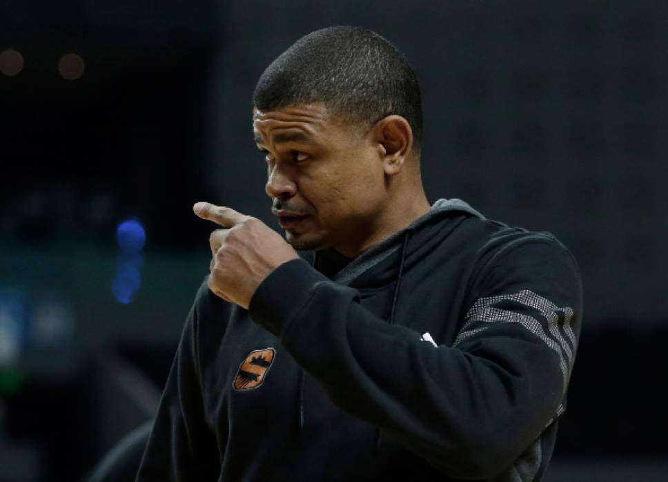Phoenix Suns head coach Earl Watson gestures to players during a training session the day before their game against the Dallas Mavericks, at Mexico City Arena in Mexico City, Wednesday, Jan. 11, 2017. (AP Photo/Rebecca Blackwell)