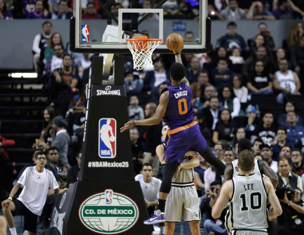 Phoenix Suns Marquese Chriss does a layup against the San Antonio Spurs in the first half of their regular-season NBA basketball game in Mexico City, Saturday, Jan. 14, 2017. (AP Photo/Rebecca Blackwell)