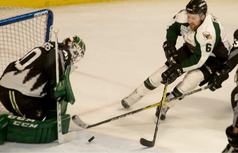 Rick Egan  |  The Salt Lake Tribune

Idaho Steelheads goalie Philippe Desrosiers (30) deflects a shot by Utah Grizzlies forward Colin Martin (6), in ECHL hockey action, Utah Grizzlies vs. Idaho Steelheads, during the annual Martin Luther King Holiday matinee game, at the Maverick Center, Monday, January 16, 2017.