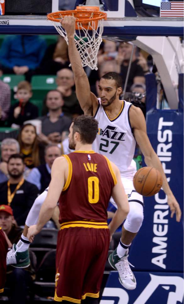 Steve Griffin / The Salt Lake Tribune

Utah Jazz center Rudy Gobert (27) hangs on the rim after slamming the ball for two during the Utah Jazz versus Cleveland Cavaliers NBA basketball game at Vivint Smart Home Arena in Salt Lake City Tuesday January 10, 2017.