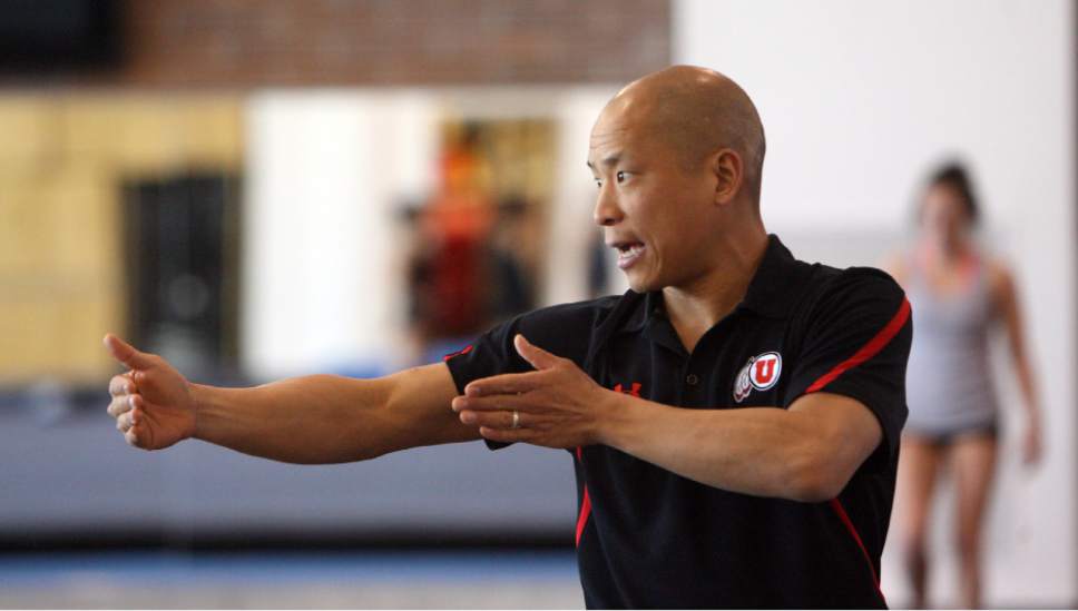 Steve Griffin |  Tribune file photo

University of Utah assistant coach Tom Farden works with gymnasts during practice at the Utah gymnastics practice facility on the campus of the University of Utah in Salt Lake City Friday March 30, 2012.