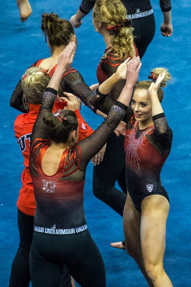 Chris Detrick  |  The Salt Lake Tribune
Utah's Mykayla Skinner celebrates with her teammates after competing on the floor during the gymnastics meet against Brigham Young University at the Marriott Center Friday January 13, 2017.