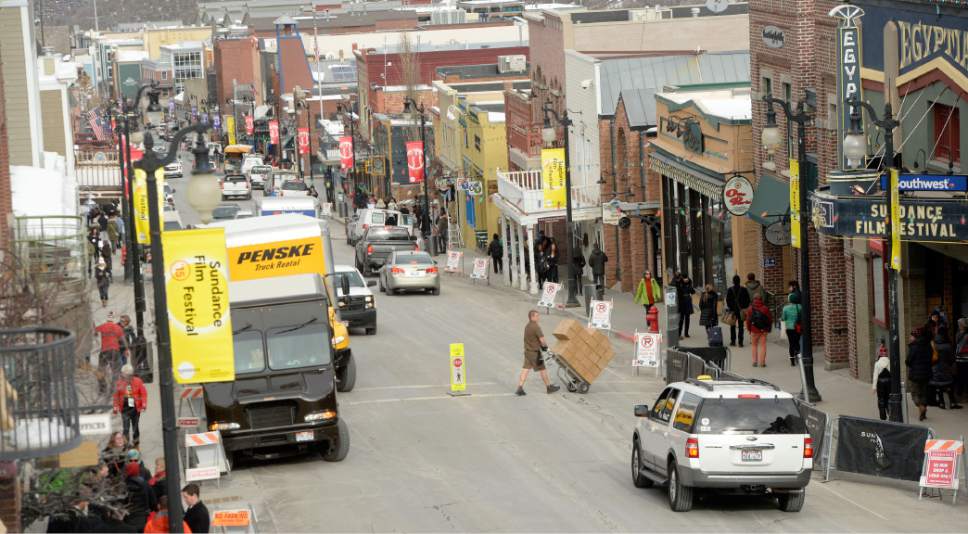 Al Hartmann  |  The Salt Lake Tribune
Delivery trucks fill Main Street as crowds of people increase Friday Jan. 23 for the Sundance Film Festival.