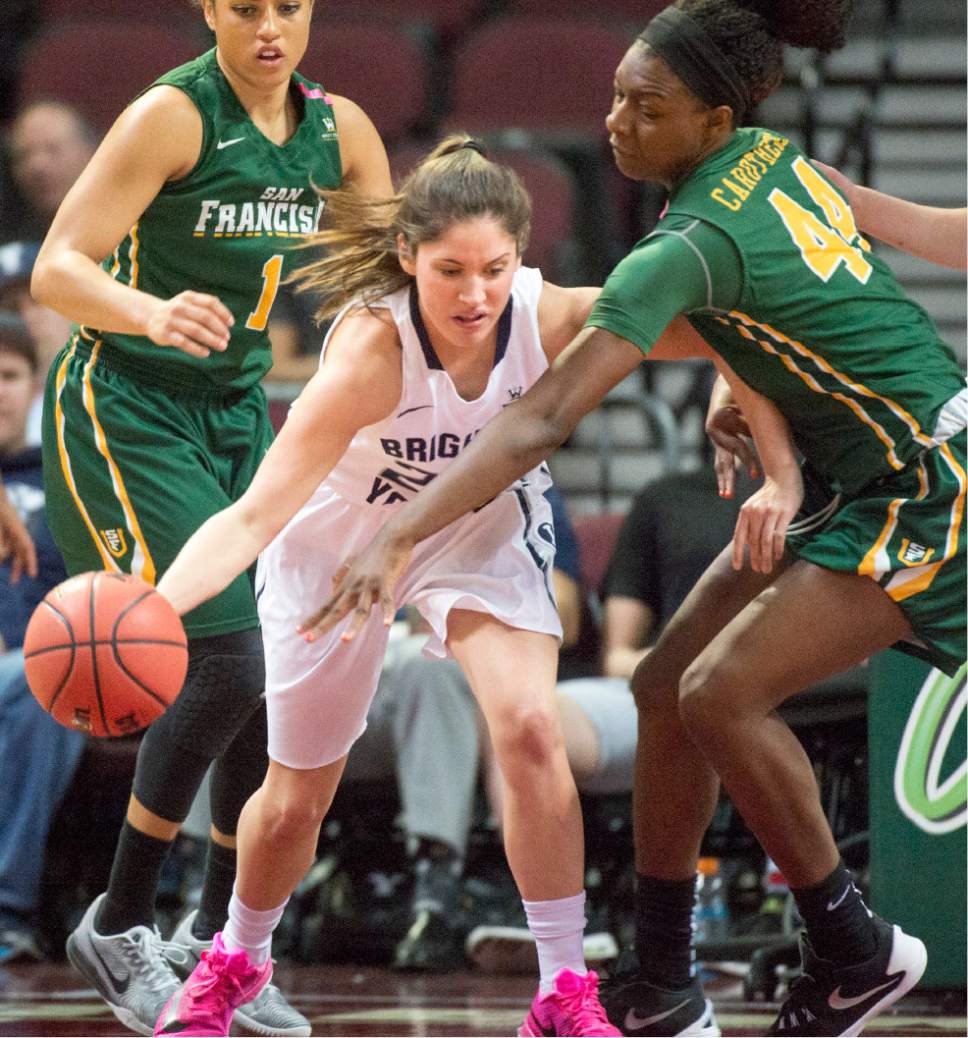 Rick Egan  |  The Salt Lake Tribune

Brigham Young Cougars guard Cassie Broadhead (20) tries to dribble, as San Francisco Lady Dons forward Hashima Carothers (44) defends,  in the West Coast Conference Championship game, at the Orleans Arena in Las Vegas, Tuesday, March 8, 2016.