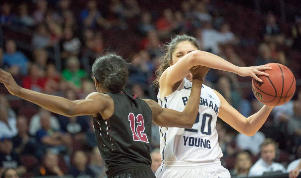 Rick Egan  |  The Salt Lake Tribune

Santa Clara Broncos guard Kyla Martin (12) tries to stop Brigham Young Cougars guard Cassie Broadhead (20) in basketball action in the West Coast Conference Semifinals, at the Orleans Arena in Las Vegas, Saturday, March 7, 2016.