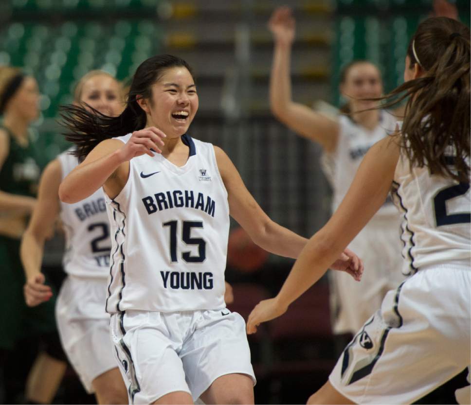 Rick Egan  |  The Salt Lake Tribune

Brigham Young Cougars guard Kylie Maeda (15) and runs to celebrate with Cassie Broadhead (20) as Makenzi Morrison (23)  runs from behind at the buzzer, as the Cougars defeated the San Francisco Dons 76-65, in the West Coast Conference Women's Basketball Championship game, at the Orleans Arena, in Las Vegas, Tuesday, March 10, 2015