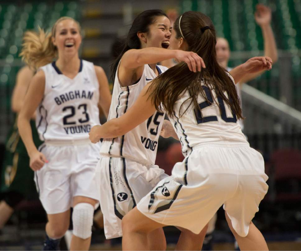 Rick Egan  |  The Salt Lake Tribune

Brigham Young Cougars guard Kylie Maeda (15) and runs to celebrate with Cassie Broadhead (20) as Makenzi Morrison (23)  runs from behind at the buzzer, as the Cougars defeated the San Francisco Dons 76-65, in the West Coast Conference Women's Basketball Championship game, at the Orleans Arena, in Las Vegas, Tuesday, March 10, 2015