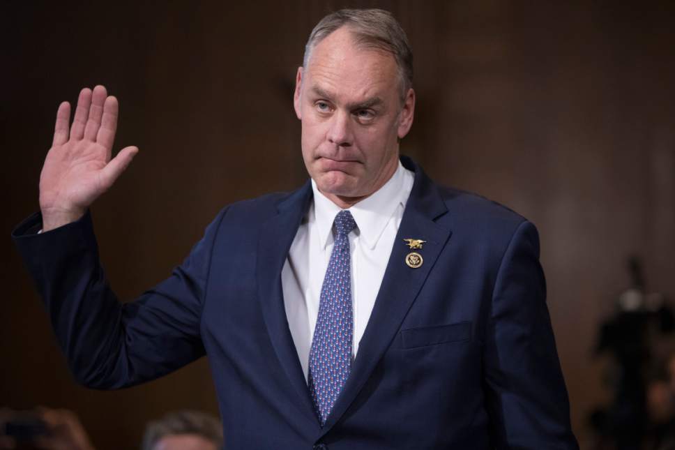 Interior Secretary-designate, Rep. Ryan Zinke, R-Mont., is sworn in on Capitol Hill in Washington, Tuesday, Jan. 17, 2017, prior to testifying at his confirmation hearing before the Senate Energy and Natural Resources Committee. Zinke, 55, a former Navy SEAL who just won his second term in Congress, was an early supporter of President-elect Donald Trump and, like his prospective boss, has expressed skepticism about the urgency of climate change. (AP Photo/J. Scott Applewhite)