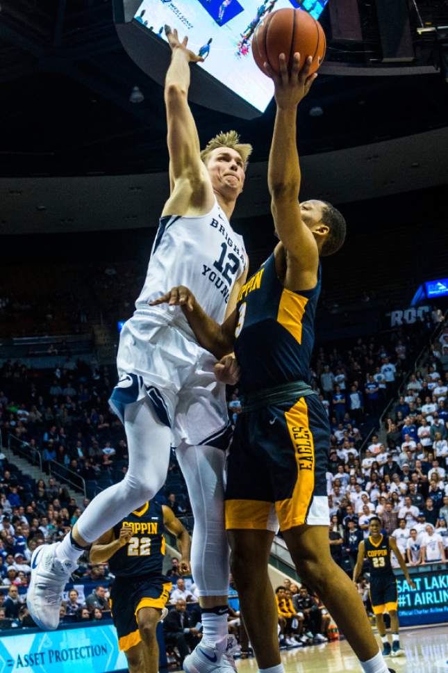 Chris Detrick  |  The Salt Lake Tribune
Brigham Young Cougars forward Eric Mika (12) blocks Coppin State Eagles guard Joshua Treadwell (3) during the game at the Marriott Center Thursday November 17, 2016.