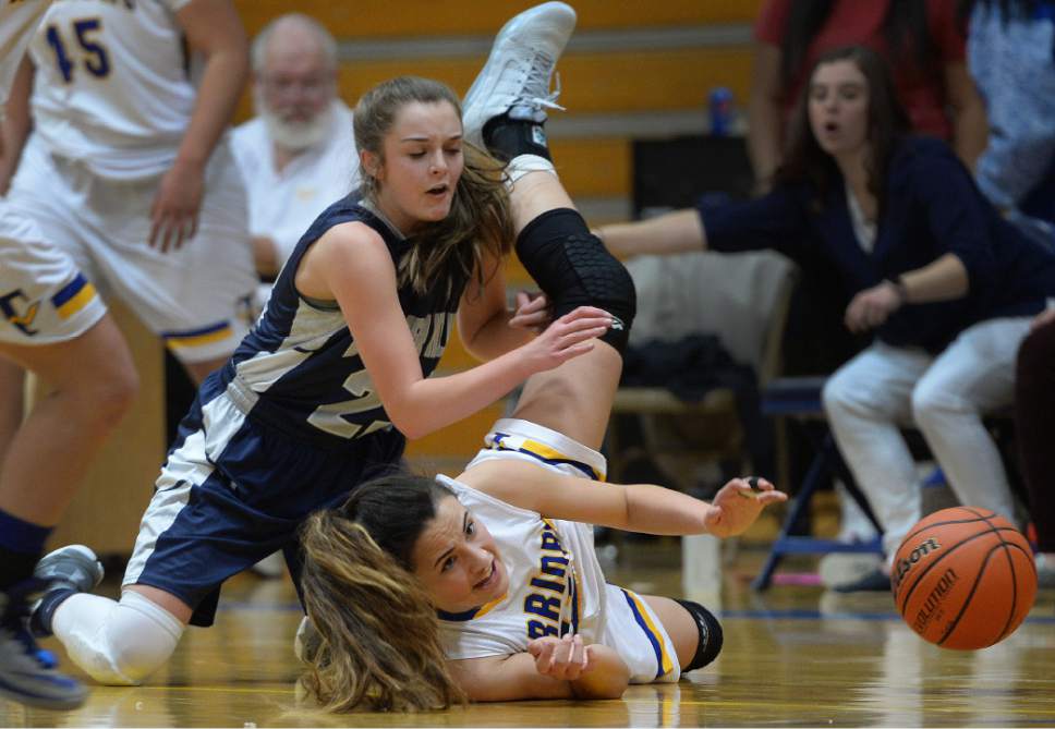 Steve Griffin / The Salt Lake Tribune

Copper Hills guard Breanna Gillen, left, and Taylorsville's Morgan Toluono crashes to the floor as the ball bounces  away during girl's basketball game at Taylorsville High School in Taylorsville Tuesday January 17, 2017.