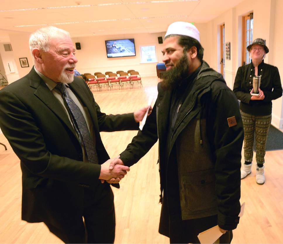 Al Hartmann  |  The Salt Lake Tribune
Rev. Tom Goldsmith greets Imam Shuaib Din at an Inauguration Interfaith Prayer Service at the First Unitarian Church in Salt Lake City Friday Jan. 20 as Donald Trump  takes the oath of office to become the next President of the United States. Clergy from different denoninations and religions spoke words of encouragement and solidarity.