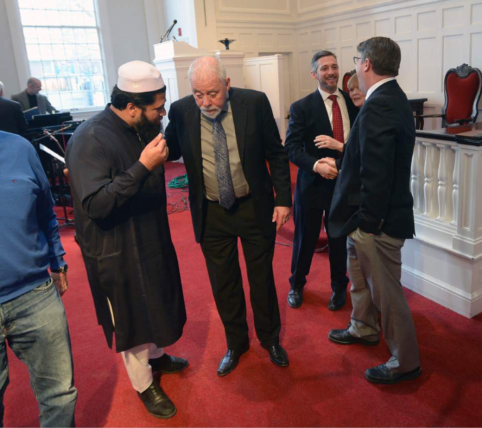 Al Hartmann  |  The Salt Lake Tribune
Imam Shuaib Din, left, speaks with Rev. Tom Goldsmith at an Inauguration Interfaith Prayer Service at the First Unitarian Church in Salt Lake City Friday Jan. 20 as Donald Trump  takes the oath of office to become the next President of the United States. Clergy from different denoninations and religions spoke words of encouragement and solidarity.