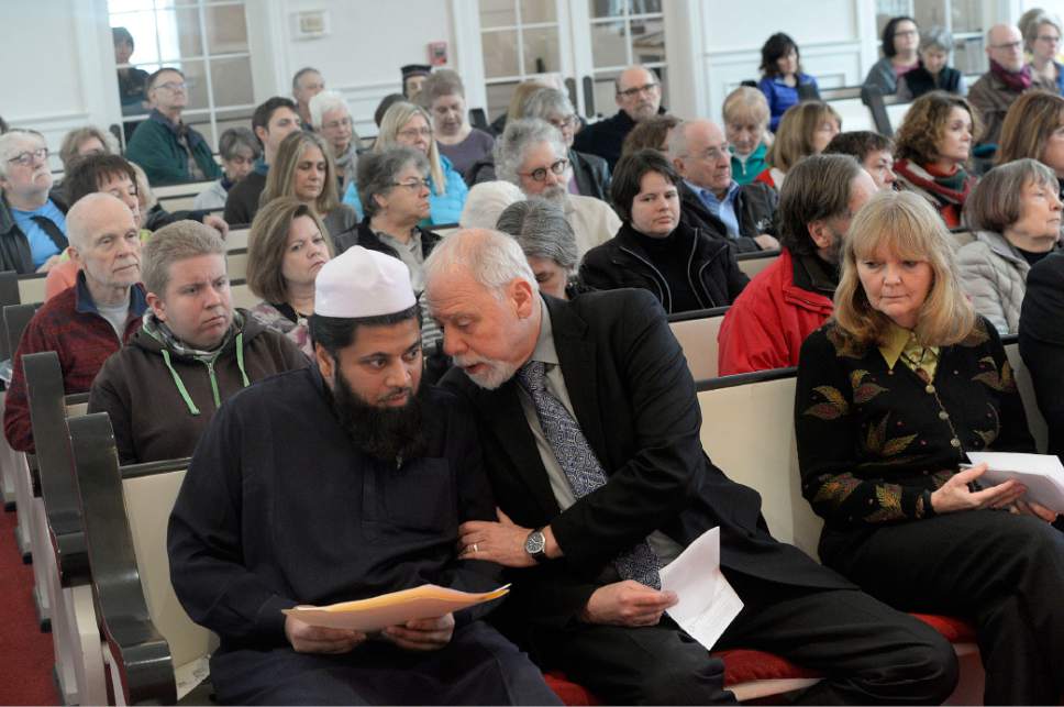 Al Hartmann  |  The Salt Lake Tribune
Imam Shuaib Din, left, and Rev. Tom Goldmsith speak at an Inauguration Interfaith Prayer Service at the First Unitarian Church in Salt Lake City Friday Jan. 20 as Donald Trump  takes the oath of office to become the next President of the United States. Clergy from several denoninations spoke words of encouragement peace and solidarity.
