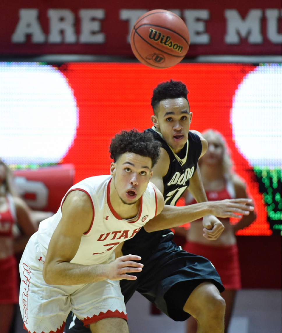 Lennie Mahler  |  The Salt Lake Tribune

Utah guard Devon Daniels and Colorado guard Derrick White race for a loose ball in the second half of a game against the Colorado Buffaloes on Sunday, Jan. 1, 2017, at the Huntsman Center in Salt Lake City.