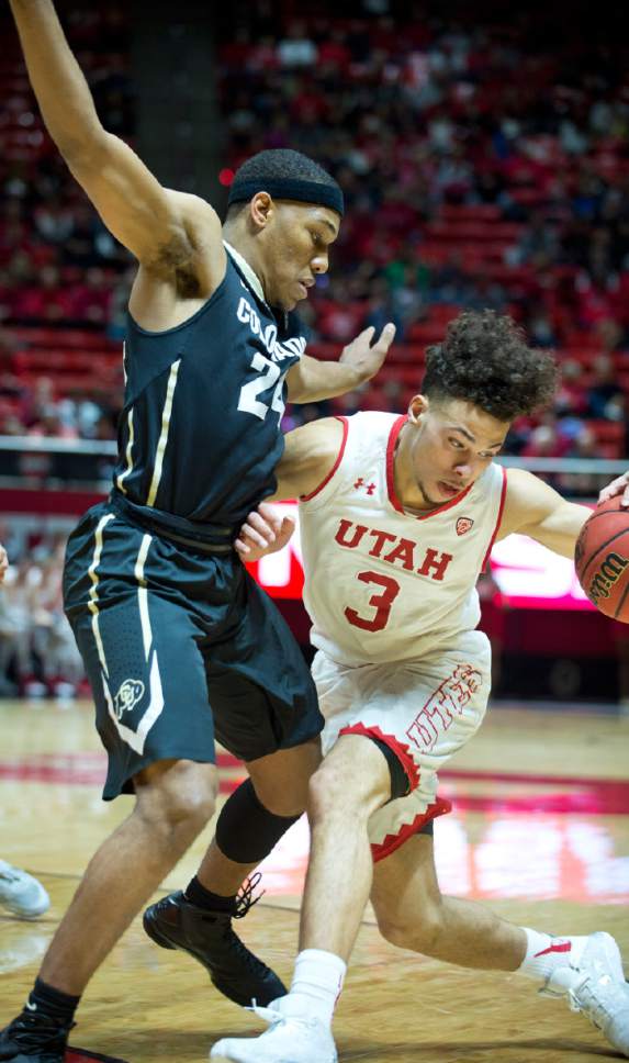 Lennie Mahler  |  The Salt Lake Tribune

Utah guard Devon Daniels drives past Colorado's George King in the first half of a game against the Colorado Buffaloes on Sunday, Jan. 1, 2017, at the Huntsman Center in Salt Lake City.