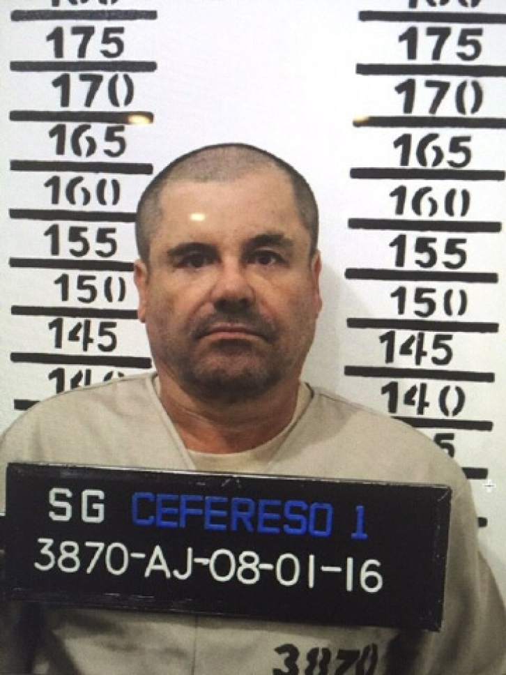 FILE - In this Jan. 8, 2016 file photo released by Mexico's federal government, Mexico's drug lord Joaquin "El Chapo" Guzman stands for his prison mug shot with the inmate number 3870 at the Altiplano maximum security federal prison in Almoloya, Mexico. According to Mexico's Foreign Ministry, Guzman was extradited to the United States on Thursday, Jan. 19 2017. (Mexico's federal government via AP, File)