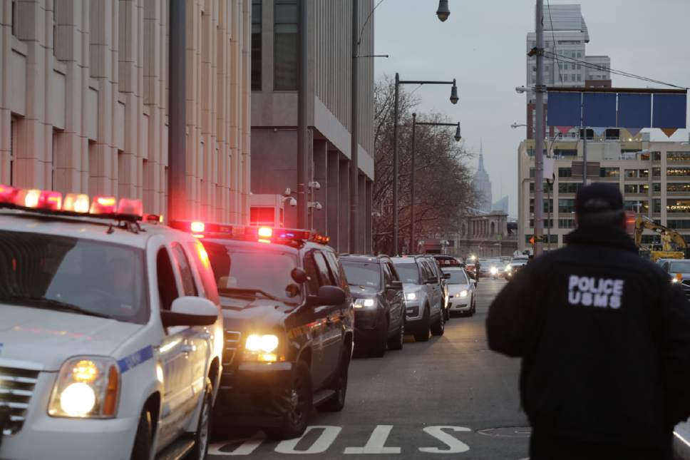 The motorcade with Joaquin "El Chapo" Guzman leaves Brooklyn Federal Court on Friday, Jan. 20, 2017 in New York.  Guzman is expected to appear in federal court in New York today. He was brought to the United States from Mexico Thursday night to face drug trafficking and other charges. (AP Photo/Mark Lennihan)