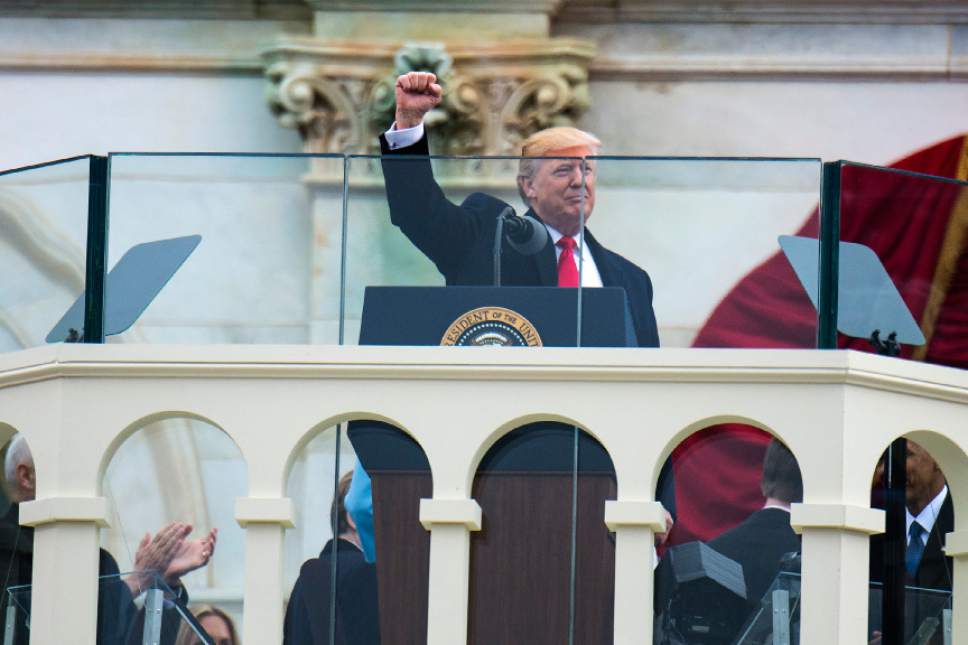 Chris Detrick  |  The Salt Lake Tribune
President Trump holds up his fist during the 58th Presidential Inauguration Ceremony at the U.S. Capitol Friday January 20, 2017.