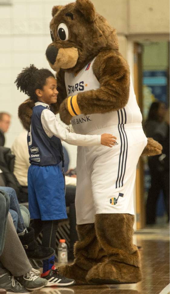 Rick Egan  |  The Salt Lake Tribune

Jackman Brough, 9, gets a hug from Buster Bear during a break in the action as e, in NBA D League action, The Salt Lake Stars vs. The Canton Charge, at Salt Lake Community College, Saturday, January 7, 2017.