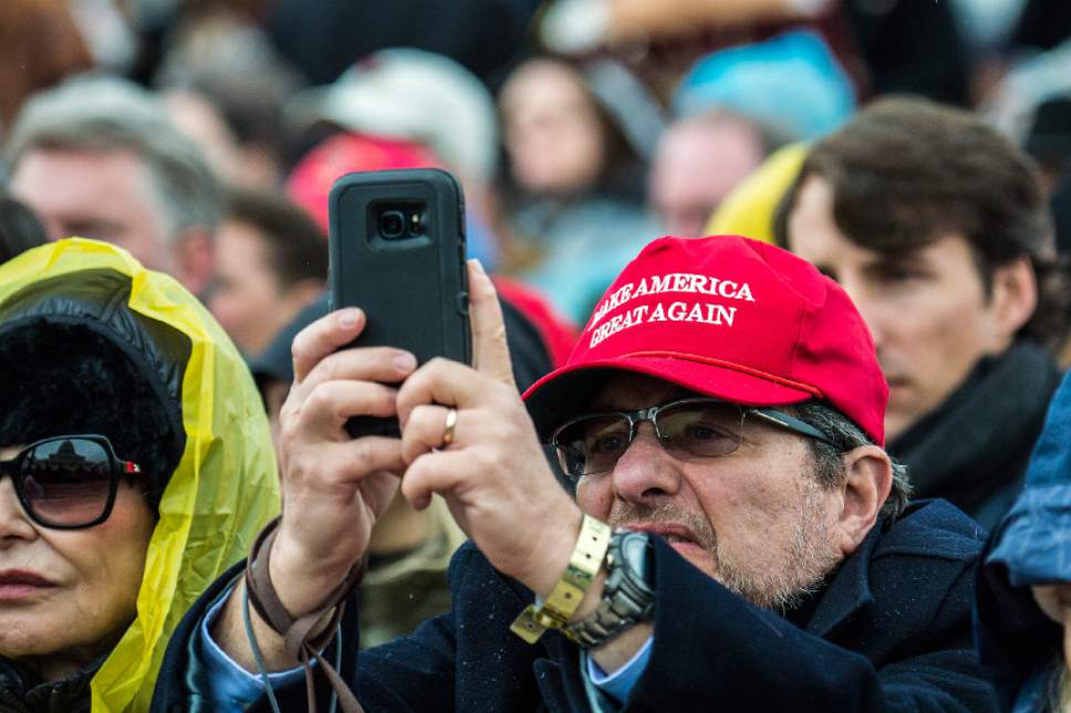 Chris Detrick  |  The Salt Lake Tribune
Members of the take photos as President Trump delivers his inaugural address during the 58th Presidential Inauguration Ceremony at the U.S. Capitol Friday January 20, 2017.