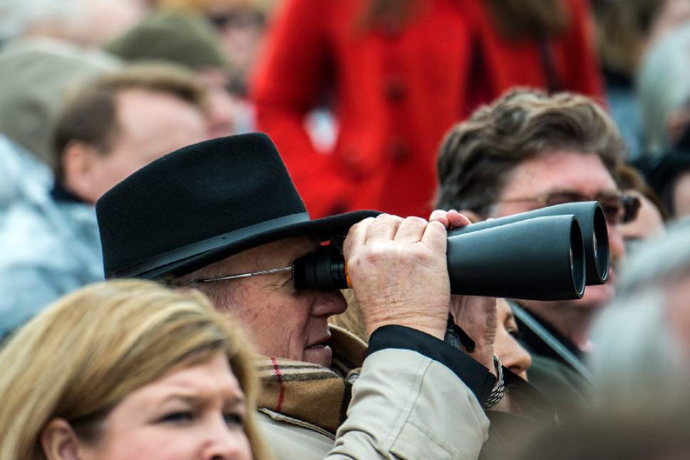 Chris Detrick  |  The Salt Lake Tribune
A man uses binoculars to watch the 58th Presidential Inauguration Ceremony at the U.S. Capitol Friday January 20, 2017.