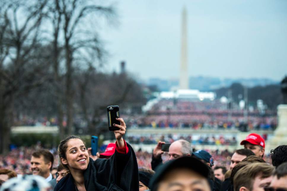 Chris Detrick  |  The Salt Lake Tribune
A woman takes cell phone pictures during the 58th Presidential Inauguration Ceremony at the U.S. Capitol Friday January 20, 2017.