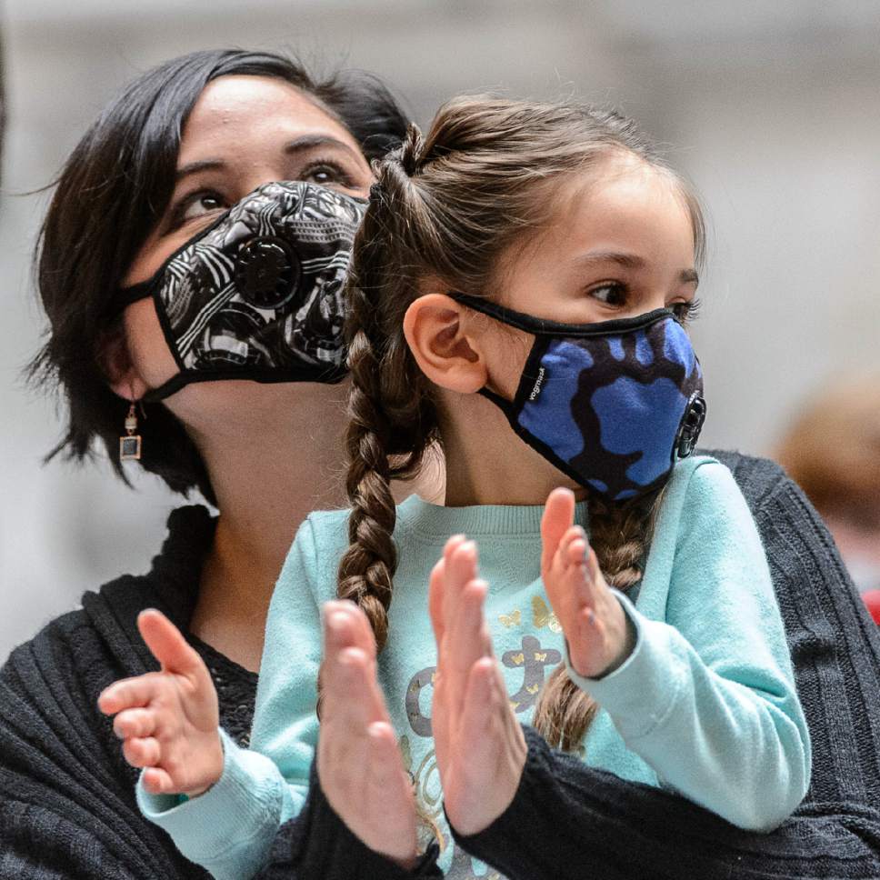 Trent Nelson  |  The Salt Lake Tribune
Stephanie and Aviana Felts wear masks at a rally focusing on clean air, Saturday January 21, 2017, on the eve of the legislative session.