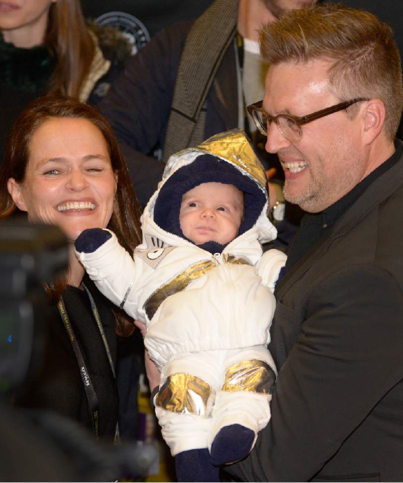 Leah Hogsten  |  The Salt Lake Tribune
l-r "The Mars Generation" film executive producer Alexandra Johnes and director Michael Barnett hold Johnes' son Quinn, 7 months, dressed in a spacesuit for the 2017 Sundance Film Festival opener in Salt Lake City for the documentary film.  "The Mars Generation" is a film about teens who aspire to be astronauts talk about going to Mars -- a goal that may be closer than many people think -- in director Michael Barnett's documentary.