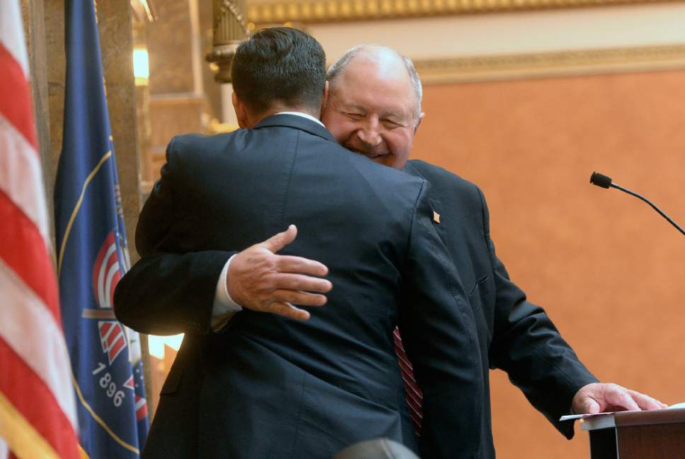 Al Hartmann  |  The Salt Lake Tribune
Former Speaker of the House Mel Brown, right, hugs incoming Speaker of the House Greg Hughes after taking the oath of office Monday Jan. 23 during the first day of the 2017 Legislative session at the Utah State Capitol.