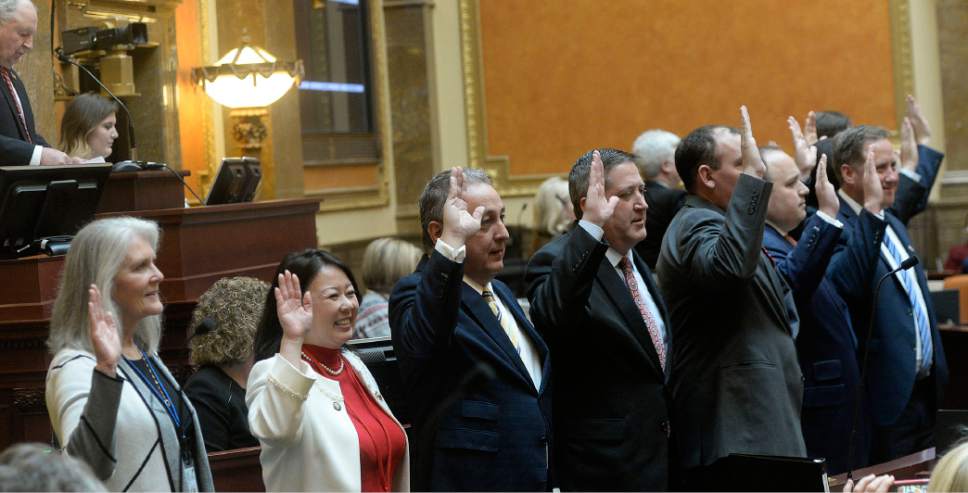 Al Hartmann  |  The Salt Lake Tribune
New members of the House of Representatives raise their hands for the oath of office Monday Jan. 23 during the first day of the 2017 Legislative session at the Utah State Capitol.