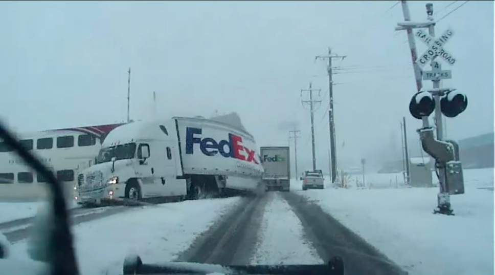|  Courtesy

Dash camera video from the North Salt Lake Police Department shows a FrontRunner train tearing through a FedEx truck on Saturday, Jan. 21, 2017.